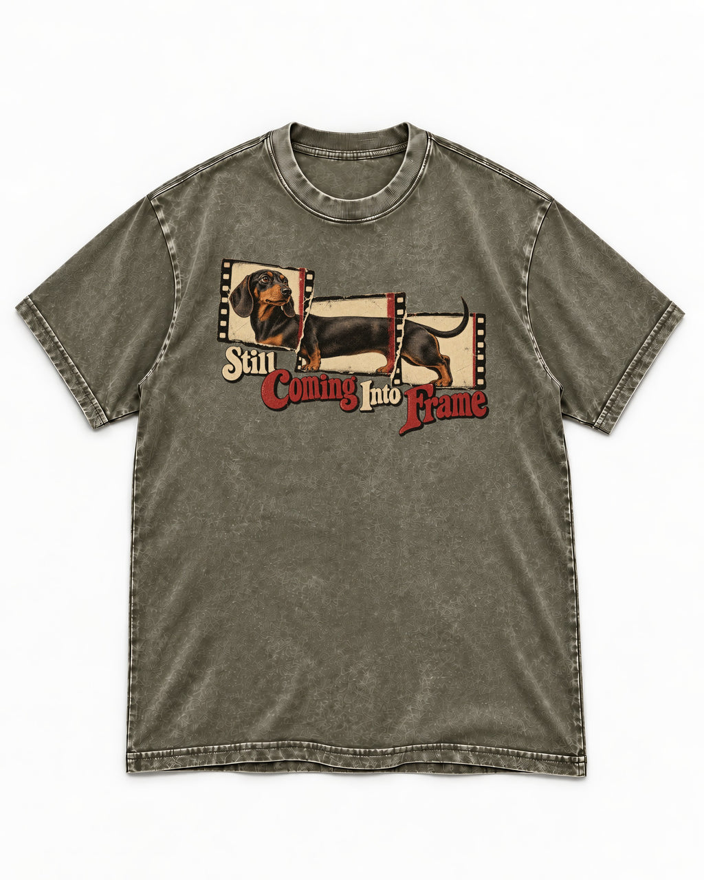 Dachshund Still Coming Into Frame Vintage Filmstrip Graphic Washed Tee in Army Green, flat lay product photo