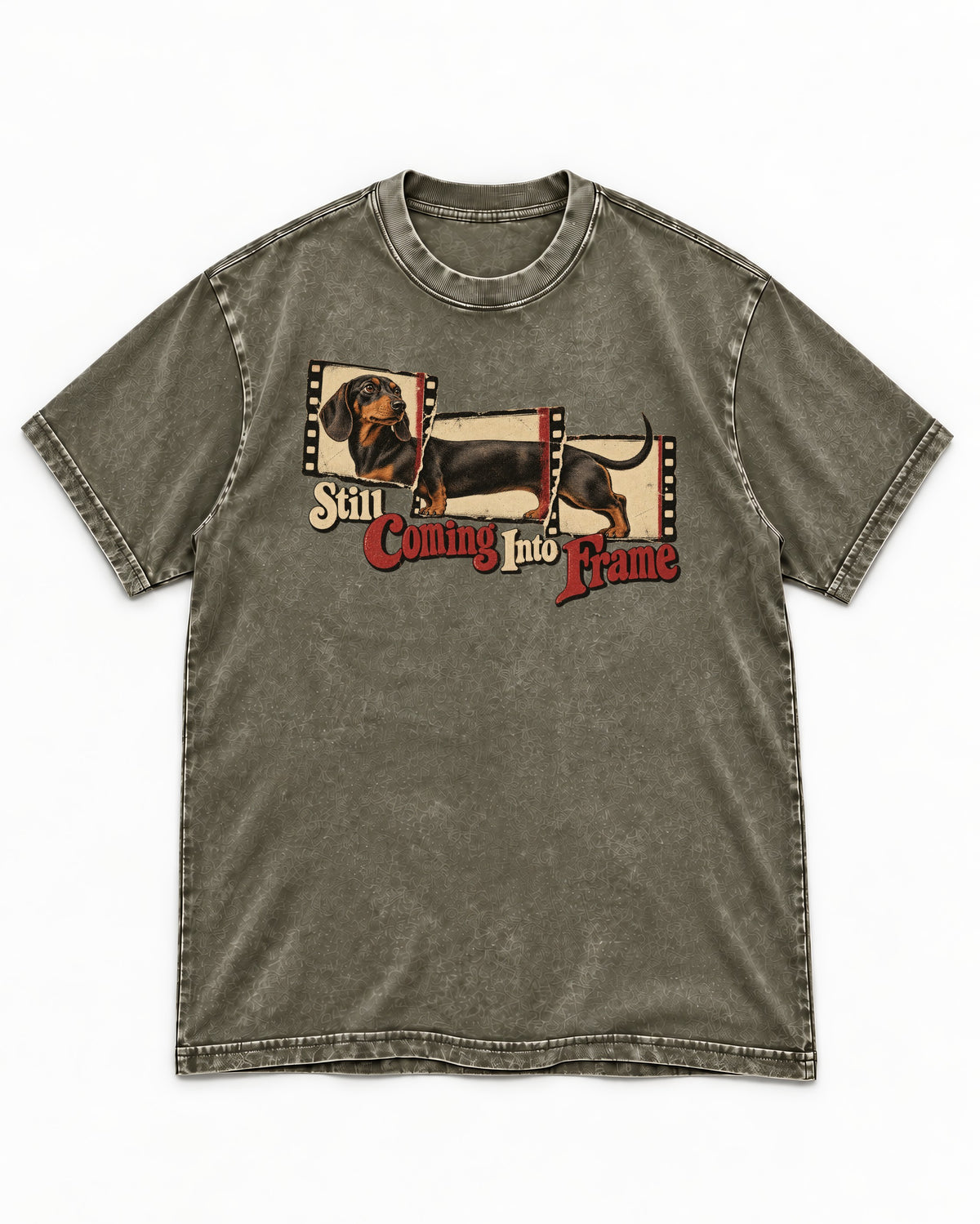 Dachshund Still Coming Into Frame Vintage Filmstrip Graphic Washed Tee in Army Green, flat lay product photo