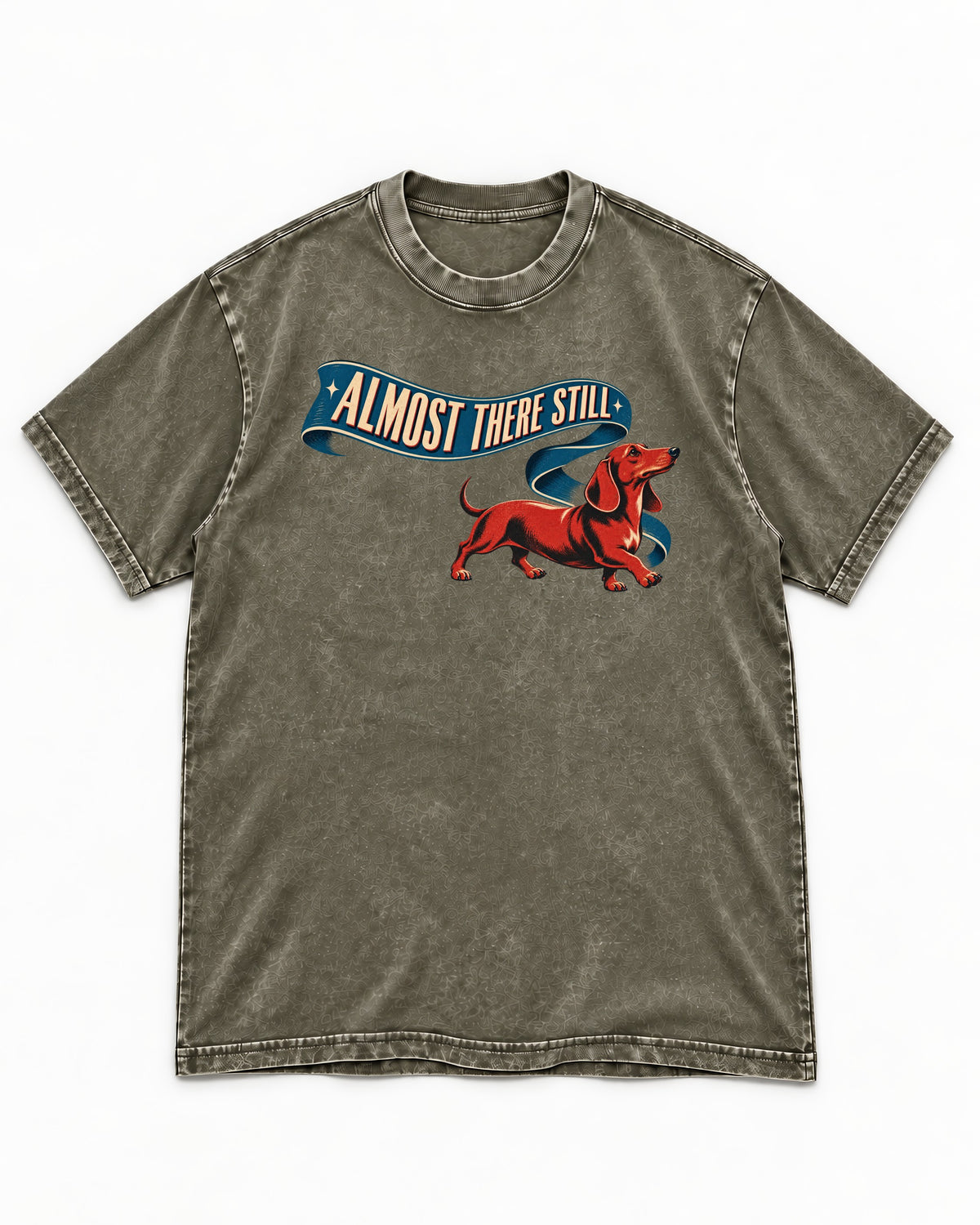 Dachshund Almost There Still Ribbon Graphic Washed Tee in Army Green, flat lay product photo