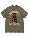 Rottweiler Serious Business Ball Under Paw Graphic Washed Tee in Army Green, flat lay product photo