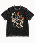Husky Late Is a State of Mind Wonderland Chase Graphic Washed Tee in Black, flat lay product photo