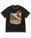 German Shorthaired Pointer Divine Timing Still Loading Creation Scene Graphic Washed Tee in Black, flat lay product photo