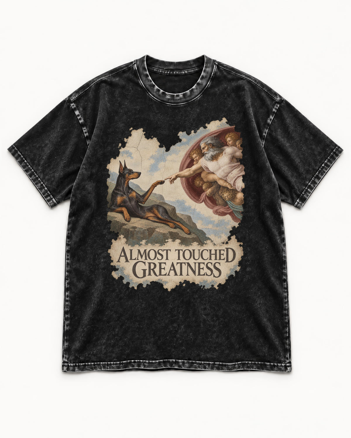 Doberman Almost Touched Greatness Creation Scene Graphic Washed Tee in Black, flat lay product photo