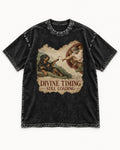 Rottweiler Divine Timing Still Loading Creation Parody Graphic Washed Tee in Black, flat lay product photo