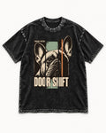 Frenchie Someone's Outside Door Shift Graphic Washed Tee in Black, flat lay product photo