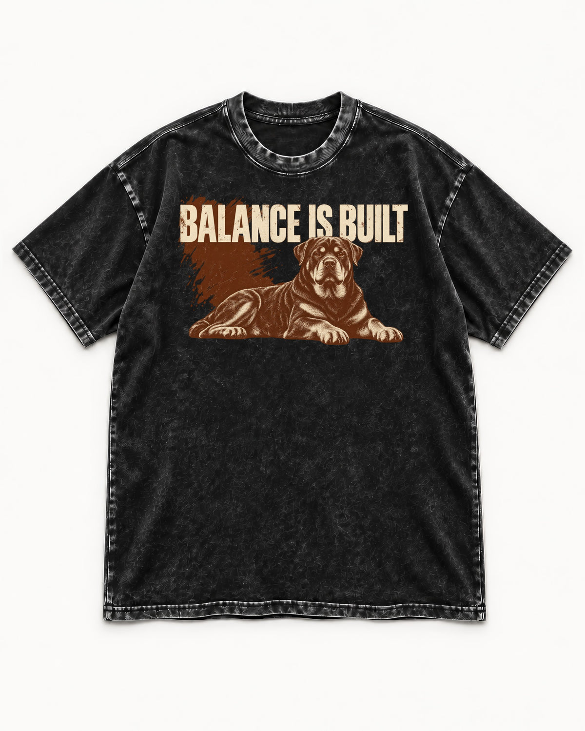 Rottweiler Balance Is Built Resting Strength Graphic Washed Tee in Black, flat lay product photo