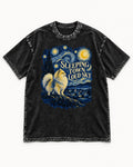 Pomeranian Sleeping Town Loud Sky Starry Night Graphic Washed Tee in Black, flat lay product photo