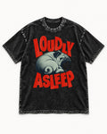 Pug Loudly Asleep Curled Yawn Graphic Washed Tee in Black, flat lay product photo